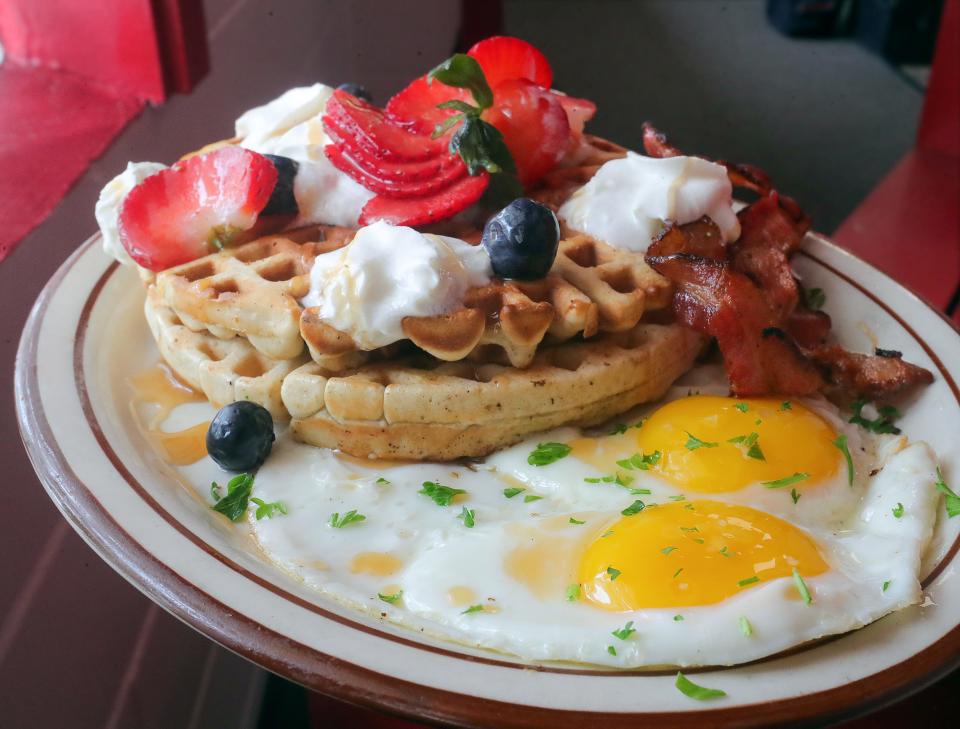The Kick-start Breakfast has eggs, meat and waffles.