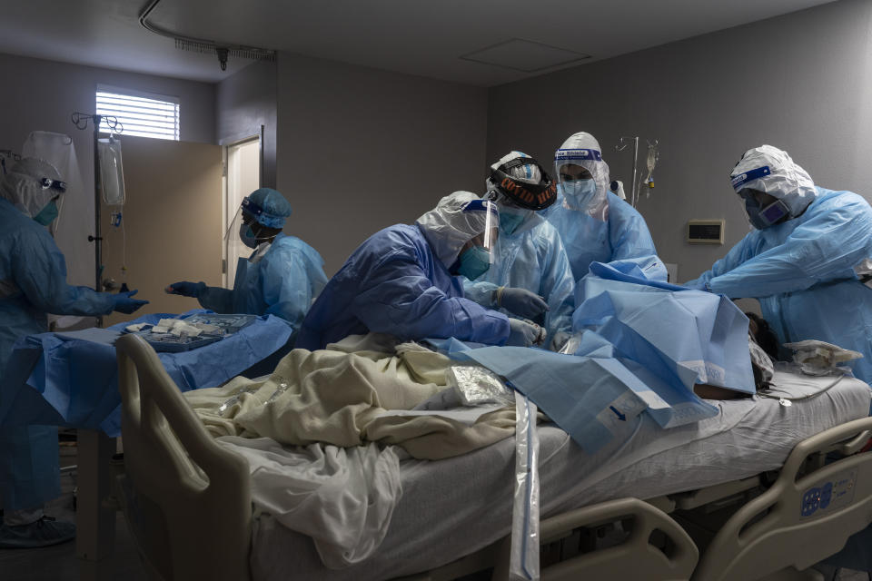 HOUSTON, TX - NOVEMBER 10: (EDITORIAL USE ONLY) Medical staff members treat a patient suffering from coronavirus in the COVID-19 intensive care unit (ICU) at the United Memorial Medical Center (UMMC) on November 10, 2020 in Houston, Texas. According to reports, COVID-19 infections are on the rise in Houston, as the state of Texas has reached over 1,030,000 cases, including over 19,000 deaths.  (Photo by Go Nakamura/Getty Images)