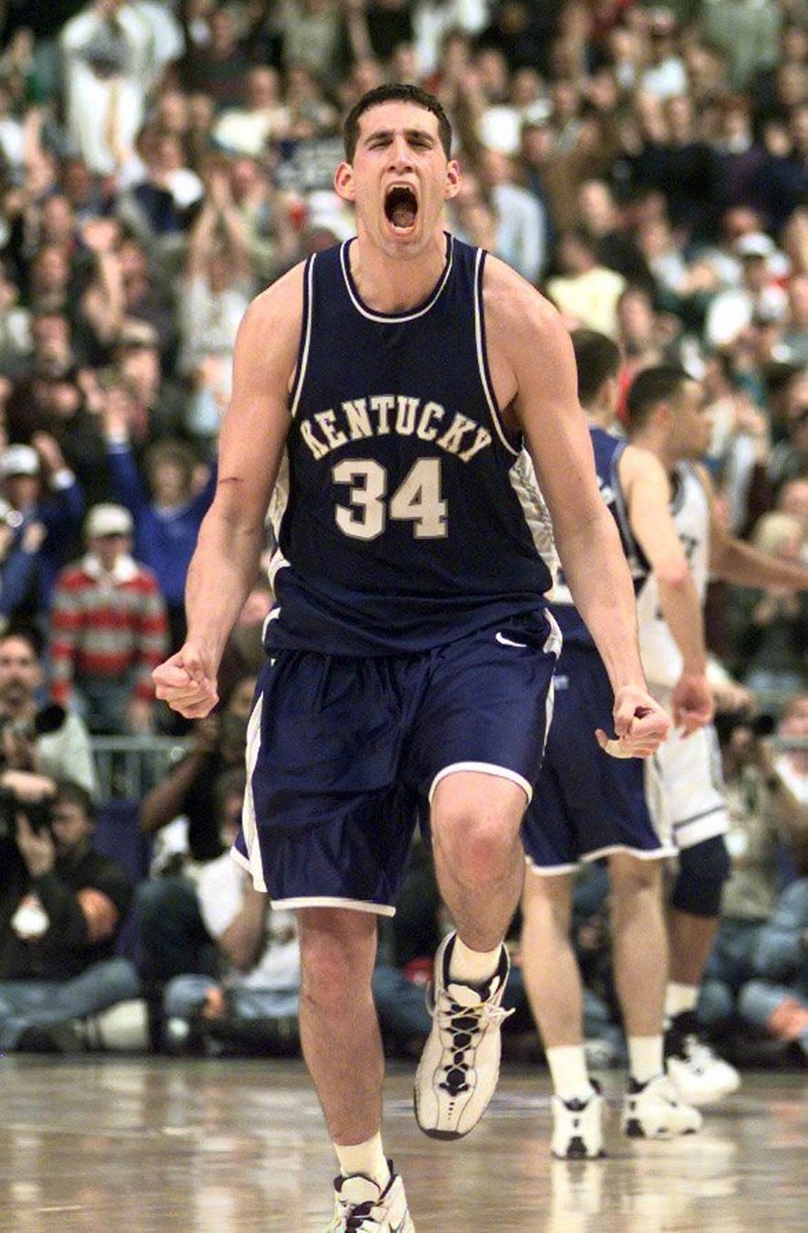 Scott Padgett celebrates after his three-pointer put Kentucky ahead to stay in what became an 86-84 victory over Duke in the 1998 NCAA Tournament South Region finals in St. Petersburg, Florida.
