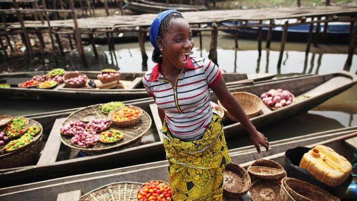 Trader on a boat in Benin