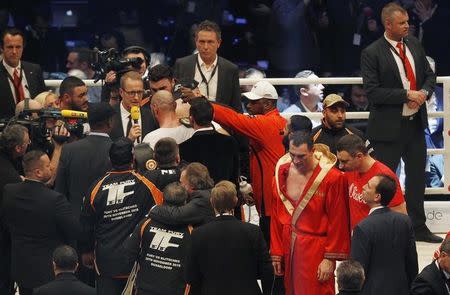 Boxing - Wladimir Klitschko v Tyson Fury WBA, IBF & WBO Heavyweight Title's - Esprit Arena, Dusseldorf, Germany - 28/11/15 Tyson Fury celebrates after being declared the winner of the fight as Wladimir Klitschko look dejected with brother Vitaly Reuters / Ina Fassbender Livepic