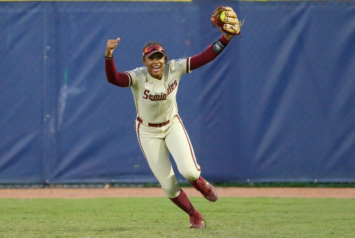 Jun 7, 2021; Oklahoma City, Oklahoma, USA; Florida State utility Kalei Harding (8) makes a catch in the outfield to end the game and defeat Alabama during an NCAA WomenÕs College World Series semi finals game at USA Softball Hall of Fame Stadium. Mandatory Credit: 
Alonzo Adams-USA TODAY Sports