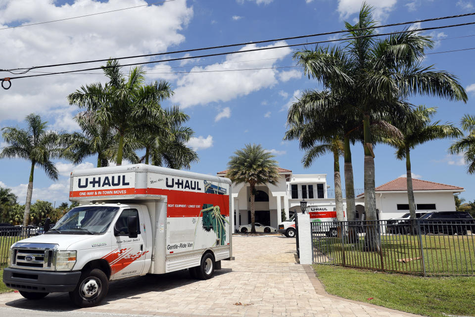 A U-Haul is seen leaving Sean Kingston's Southwest Ranches, Fla., home Thursday, May 23, 2024. A SWAT team raided rapper Kingston's rented mansion on Thursday, and arrested his mother on fraud and theft charges that an attorney says stems partly from the installation of a massive TV at the home. (Amy Beth Bennett/South Florida Sun-Sentinel via AP)