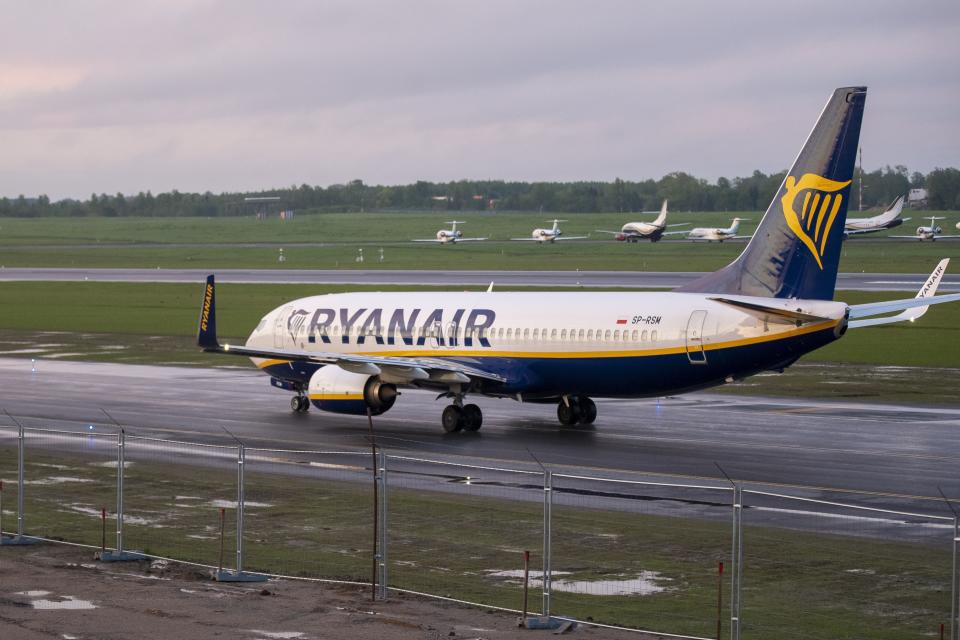 The Ryanair plane with registration number SP-RSM, carrying opposition figure Raman Pratasevich which was traveling from Athens to Vilnius and was diverted to Minsk after a bomb threat, lands at the International Airport outside Vilnius, Lithuania, Sunday, May 23, 2021. The presidential press service said President Alexander Lukashenko personally ordered that a MiG-29 fighter jet accompany the Ryanair plane carrying opposition figure Raman Pratasevich and traveling from Athens, Greece, to Vilnius, Lithuania to the airport in the capital Minsk. (AP Photo/Mindaugas Kulbis)