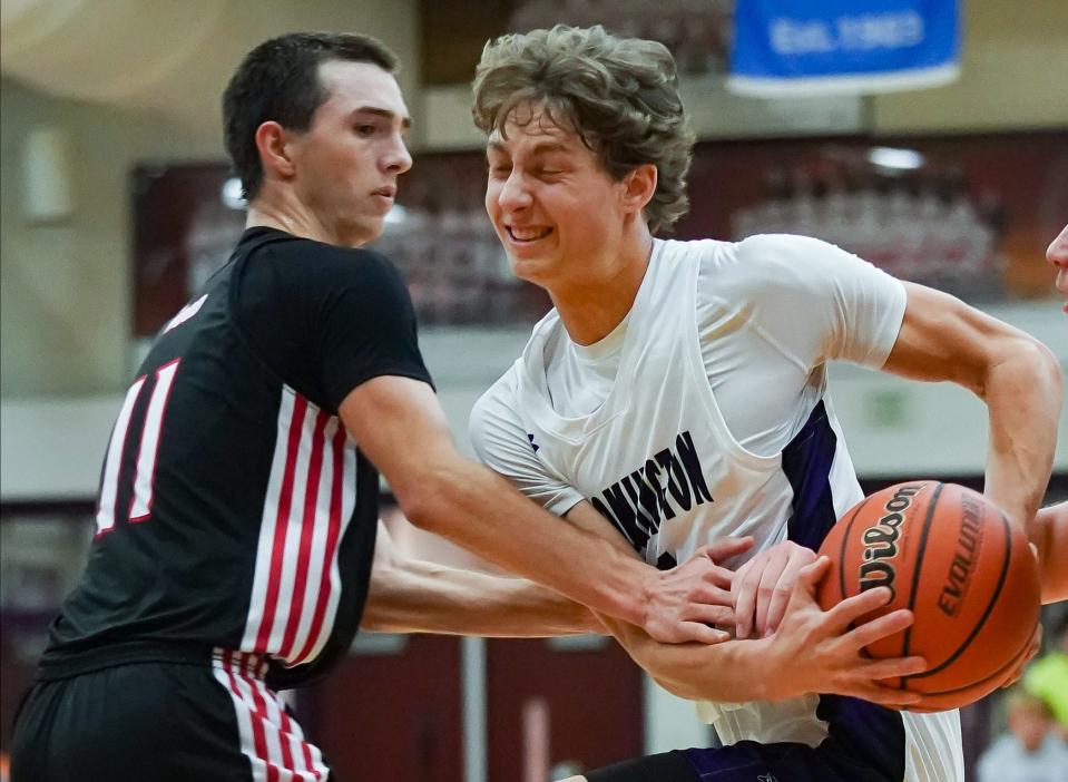 Bloomington South’s Alex Shaevitz is fouled by Edgewood's Jacob Boggs as he drives to the basket during their boys’ basketball game at South on Tuesday, Nov. 21, 2023.