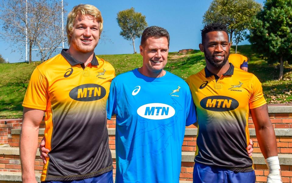 (L-R) The Springboks' Pieter-Steph du Toit, who will lead South Africa in a one-off Test against Wales on June 2, new coach Rassie Erasmus and flanker Siya Kolisi, the first black Test captain who will lead South Africa in a three-Test series against England in June - AFP