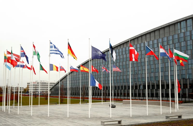 Flags of NATO member countries are seen at the Alliance headquarters in Brussels