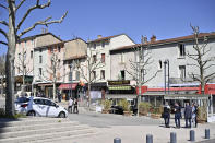 Police officers patrol after a man wielding a knife attacked residents venturing out to shop in the town under lockdown, Saturday April 4, 2020 in Romans-sur-Isere, southern France. The alleged attacker was arrested by police nearby, shortly after the attack. Prosecutors did not identify him. They said he had no documents but claimed to be Sudanese and to have been born in 1987. (AP Photo)