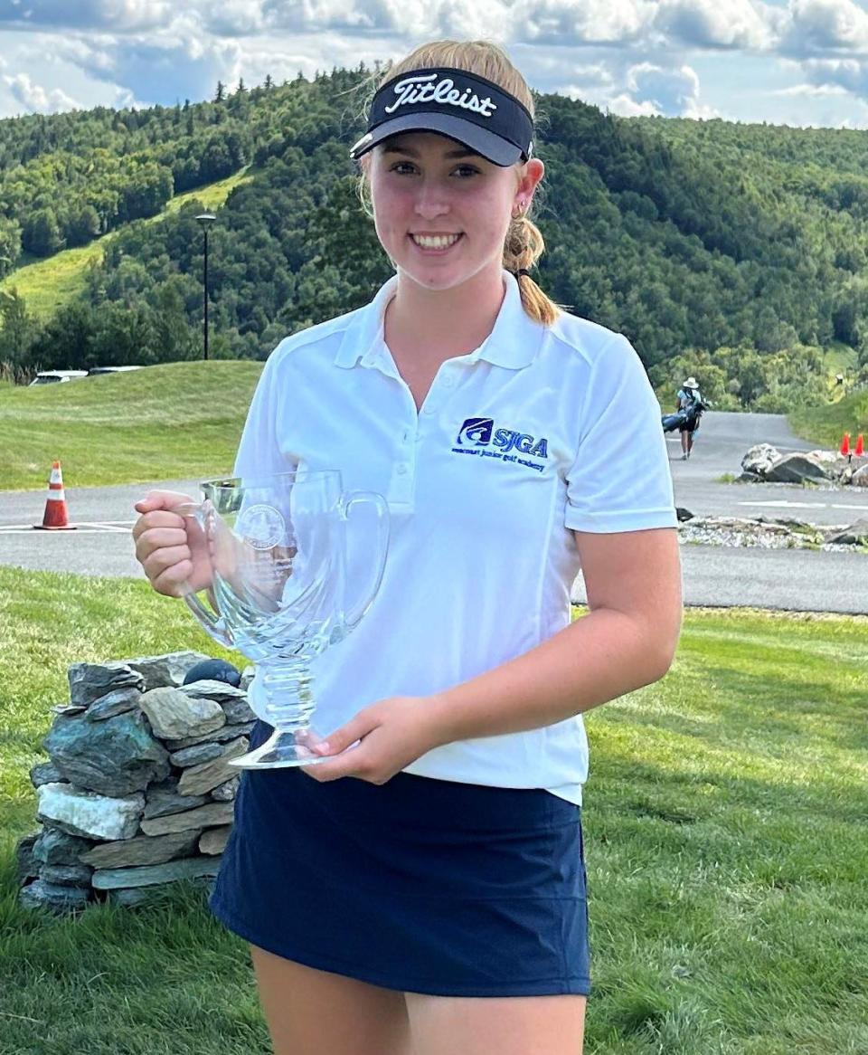 Carys Fennessy, a rising junior at Dover High School, holds her trophy after winning the New Hampshire Women’s Golf Championship on Wednesday, Aug. 2, 2023, at Montcalm Golf Club.
