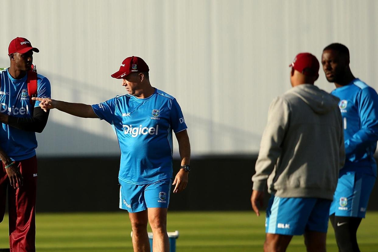 Jason Holder of West Indies chats with head coach Stuart Law during a nets session at Edgbaston: Jan Kruger/Getty Images