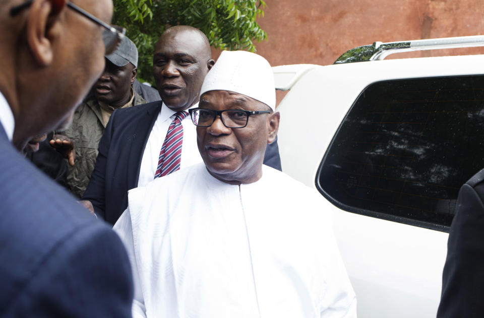 FILE - In this Sunday, Aug. 12, 2018 file photo, Malian incumbent President, Ibrahim Boubacar Keita, arrives to cast his ballot during the Presidential second round election in Bamako, Mali. Mali's President Ibrahim Boubacar Keita has won another term in a runoff election with more than 67 percent of the vote. AP Photo/Annie Risemberg, File)