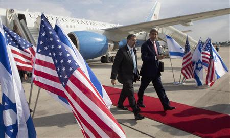 U.S. Secretary of State John Kerry is greeted by U.S. Ambassador to Israel Dan Shapiro (L) as he arrives in Tel Aviv November 8, 2013. REUTERS/Jason Reed