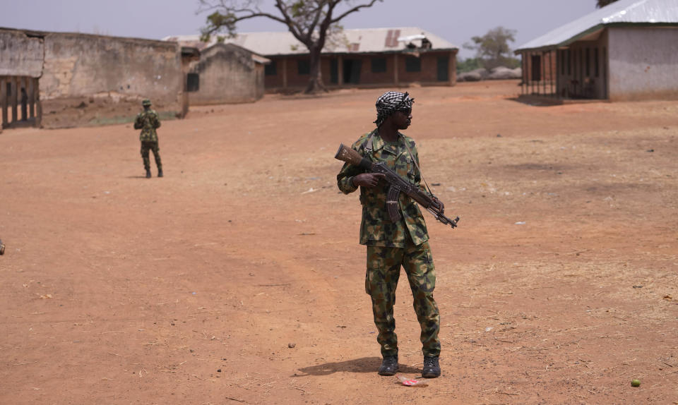 Nigerian Soldiers patrol at the LEA Primary and Secondary School Kuriga where students were kidnapped in Kuriga, Kaduna Nigeria, Saturday, March 9, 2024. Security forces swept through large forests in Nigeria's northwest region on Friday in search of nearly 300 children who were abducted from their school a day earlier in the West African nation's latest mass kidnap which analysts and activists blamed on the failure of intelligence and slow security response. (AP Photo/Sunday Alamba)