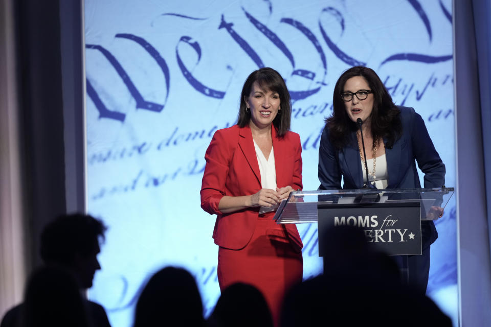 Moms for Liberty founders Tiffany Justice, right, and Tina Descovich speak at the Moms for Liberty meeting in Philadelphia, Friday, June 30, 2023. (AP Photo/Matt Rourke)