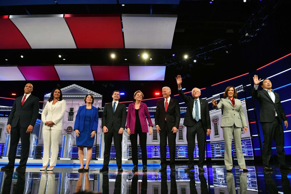 Democratic presidential hopefuls Sen. Cory Booker, D-N.J., Rep. Tulsi Gabbard, D-Hawaii, Sen. Amy Klobuchar, D-Minn., Pete Buttigieg, mayor of South Bend, Sen. Elizabeth Warren, D-Mass., Former Vice President Joe Biden, Sen. Bernie Sanders, I-Vt., Sen. Kamala Harris, D-Calif. and tech entrepreneur Andrew Yang arrive onstage for the fifthDemocratic presidential primary debate in Atlanta.