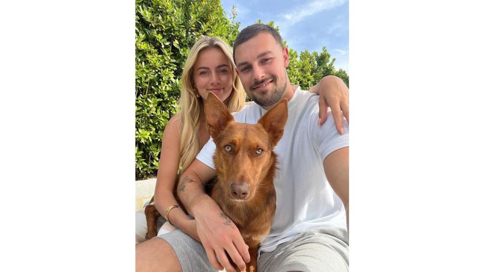 Tasha Ghouri and Andrew Le Page with a brown dog