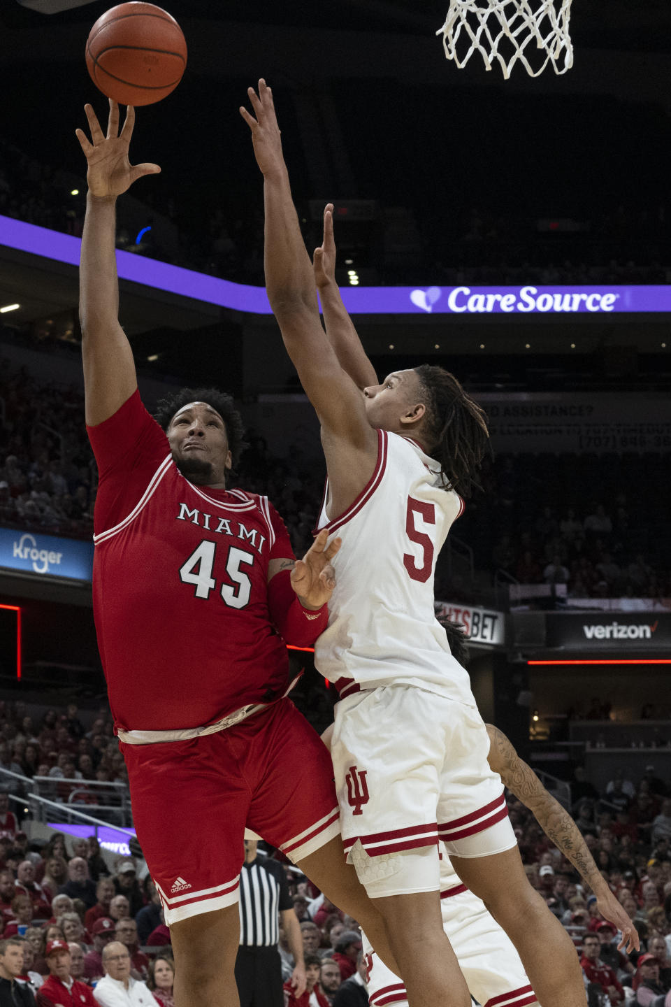 Miami (Ohio) forward Anderson Mirambeaux (45) shoots over Indiana forward Malik Reneau (5) during the first half of an NCAA college basketball game, Sunday, Nov. 20, 2022, in Indianapolis. (AP Photo/Marc Lebryk)