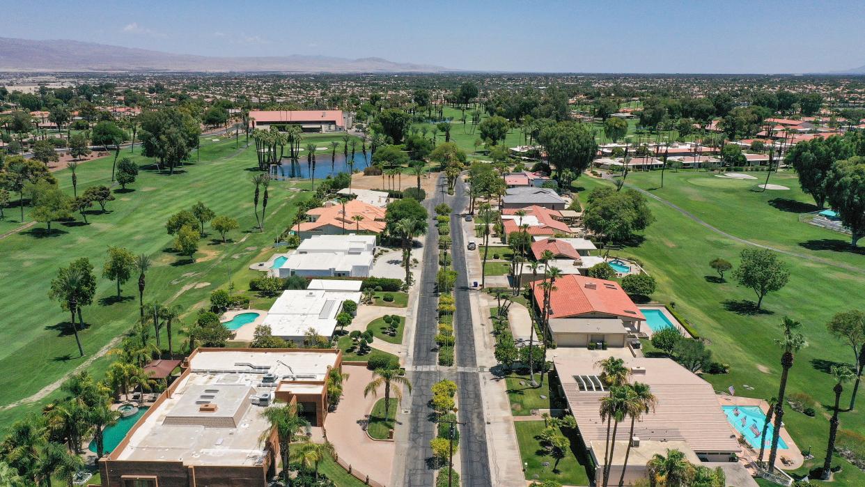 Homes along Montego Bay Dr. in Bermuda Dunes Country Club have grass yards and swimming pools as they are surrounded by the golf course in Bermuda Dunes, Calif., July 15, 2022.  Bermuda Dunes is served by the Myoma Dunes Water Company which ranked fourth in the state for most water consumed in May at 352 gallons per person per day.