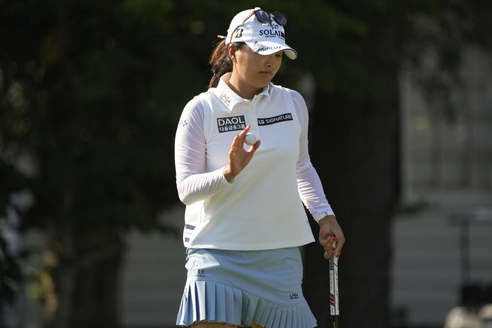 Jin Young Ko, of South Korea, waves on the ninth green during the first round of the U.S. Women's Open golf tournament at the Pine Needles Lodge & Golf Club in Southern Pines, N.C. on Thursday, June 2, 2022. (AP Photo/Chris Carlson)