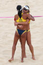 LONDON, ENGLAND - JULY 28: Larissa Franca (R) and Juliana Silva of Brazil celebrate during the Women's Beach Volleyball Preliminary Round on Day 1 of the London 2012 Olympic Games at Horse Guards Parade on July 28, 2012 in London, England. (Photo by Ryan Pierse/Getty Images)
