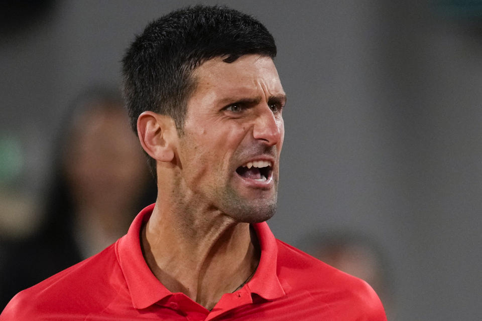 Serbia's Novak Djokovic reacts during his quarterfinal match against Spain's Rafael Nadal at the French Open tennis tournament in Roland Garros stadium in Paris, France, Tuesday, May 31, 2022. (AP Photo/Christophe Ena)