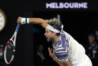 Austria's Dominic Thiem serves to Serbia's Novak Djokovic during the men's singles final at the Australian Open tennis championship in Melbourne, Australia, Sunday, Feb. 2, 2020. (AP Photo/Lee Jin-man)