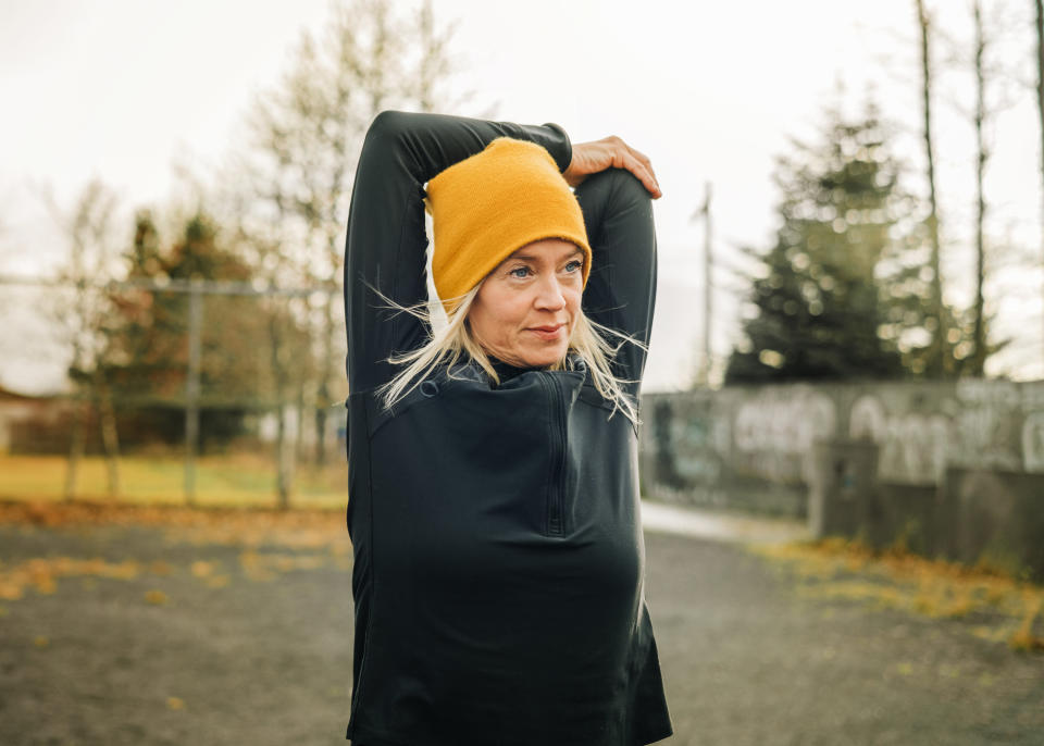 A woman stretching before a run