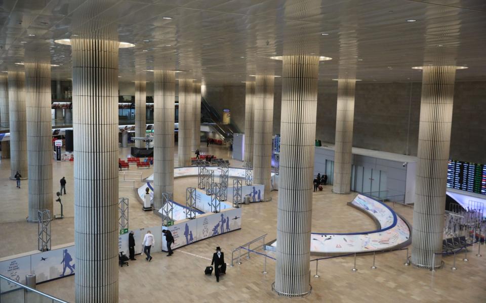 Mandatory Credit: Photo by ABIR SULTAN/EPA-EFE/Shutterstock (12652311i) An ultra Orthodox Jewish passenger at the arrivals hall of the Ben Gurion International Airport near Tel Aviv, Israel, 20 December 2021. The Israeli Ministry of Health urged the government to declare Italy, the United States, Belgium, Germany, Hungary, Morocco, Portugal, Canada, Switzerland and Turkey as at-risk countries amid the ongoing spread of the coronavirus Omicron variant of concern. Israel eyes entry restrictions amid Omicron woes, Tel Aviv - 20 Dec 2021 - Shutterstock