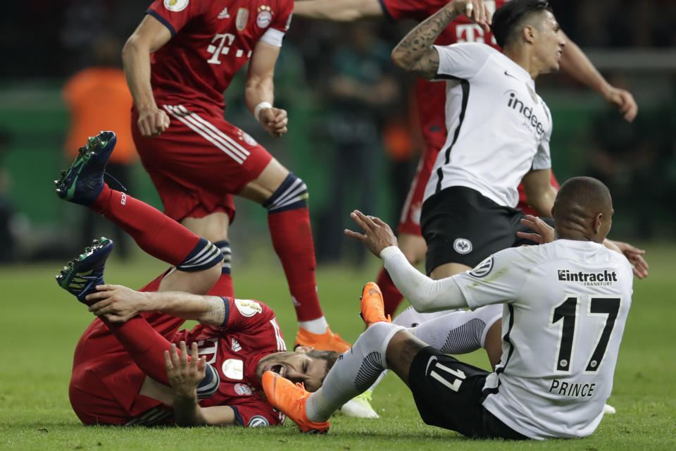 Bayern’s Javi Martinez lies on the ground during the German soccer cup final match between FC Bayern Munich and Eintracht Frankfurt in Berlin, Germany, Saturday, May 19, 2018. (AP Photo/Michael Sohn)