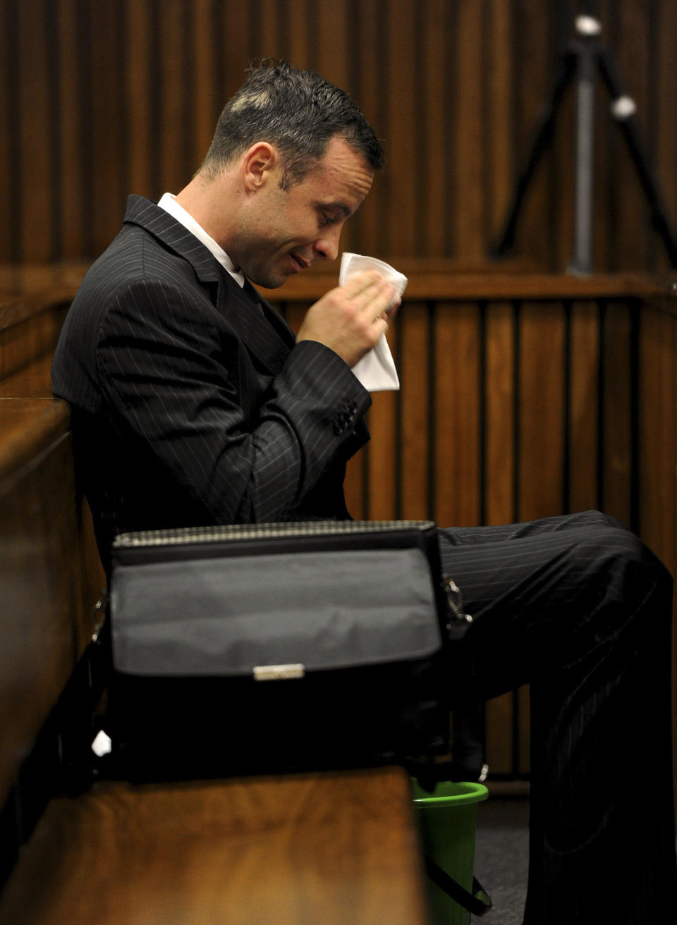 Oscar Pistorius, sits in the dock as he waits for proceedings to begin in court in Pretoria, South Africa, Tuesday, March 18, 2014. Pistorius is on trial for the murder of his girlfriend Reeva Steenkamp on Valentines Day, 2013. (AP Photo/Werner Beukes, Pool)