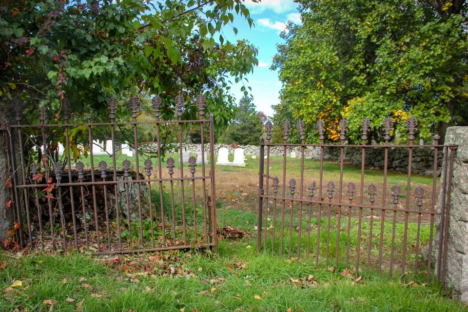 The gate stands ajar at Babcock-Gifford Cemetery on Blossom Road in Westport.