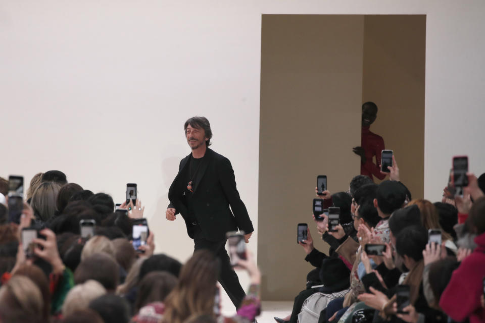 Designer Pierpaolo Piccioli accepts applause at the conclusion of the Valentino fashion collection during Women's fashion week Fall/Winter 2020/21 presented in Paris, Sunday, March 1, 2020. (AP Photo/Francois Mori)