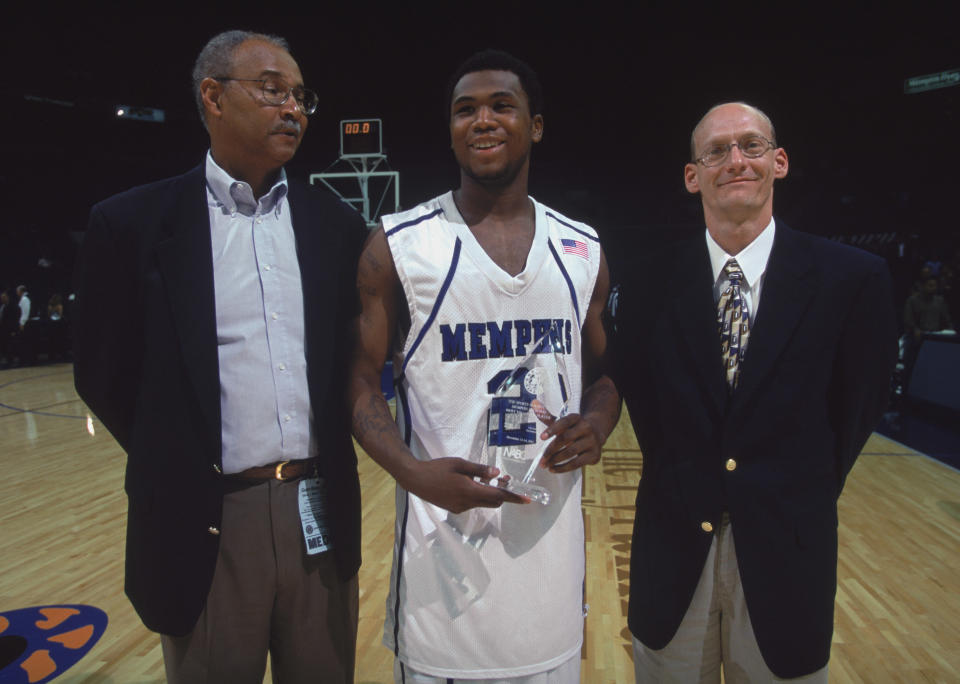 Dajuan Wagner #2 of the Memphis Tigers smiles with the MVP Trophy after the championship game of the NABC Guardian Classic in 2001. (Getty)