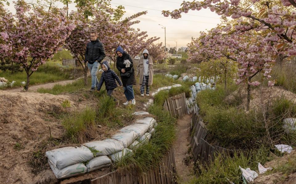 People visit trenches at a park on May 6, 2023 in Kyiv, Ukraine. Parts of the park had been fortified by Ukrainian troops defending the capital at the beginning of the Russian invasion - Roman Pilipey/Getty Images Europe