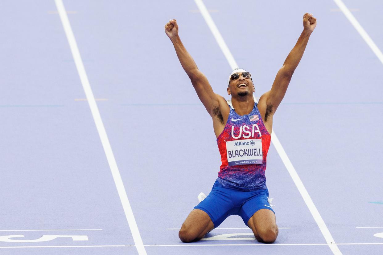 Jaydin Blackwell celebrates after winning the men's 100-meter T13 final and setting a new world record during the 2024 Paris Paralympic Summer Games at the Stade de France in Paris on Aug. 31, 2024.