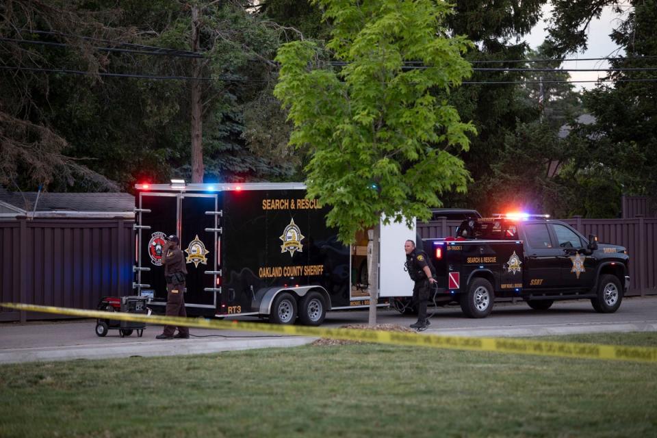 Police investigate the scene of the shooting at the Brooklands Plaza Splash Pad in Rochester Hills, Michigan on Saturday. One victim, an eight-year-old boy was shot in the head. (Getty Images)