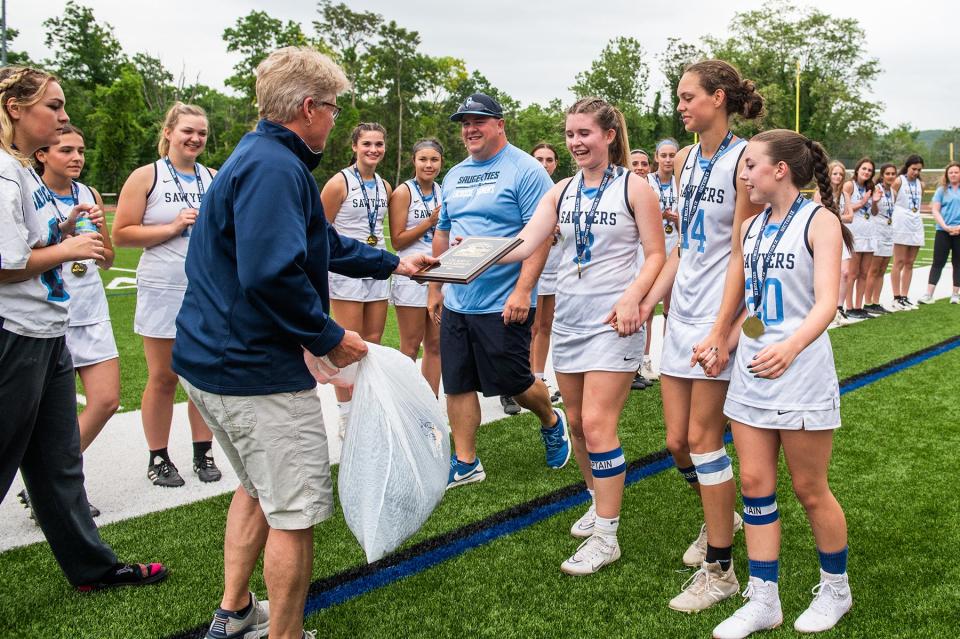 Saugerties celebrates their win during the Section 9 class C girls lacrosse championship game at O'Neill High School in Goshen, NY on Thursday, May 26, 2022. Saugerties defeated Goshen 11-8. KELLY MARSH/FOR THE TIMES HERALD-RECORD