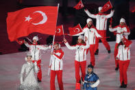 <p>Turkey’s flagbearer Faith Aroa Ipcioglu leads the delegation parade during the opening ceremony of the Pyeongchang 2018 Winter Olympic Games at the Pyeongchang Stadium on February 9, 2018. (Photo by ROBERTO SCHMIDT/AFP/Getty Images) </p>