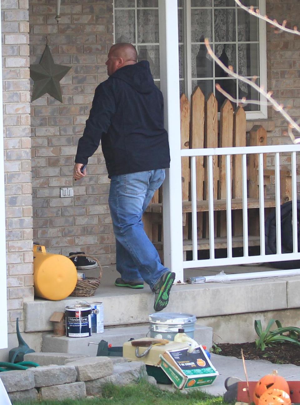 Pleasant Grove Police investigate the scene where seven infant bodies were discovered and packaged in separate containers at a home in Pleasant Grove, Utah, Sunday, April 13, 2014. (AP Photo/Rick Bowmer)