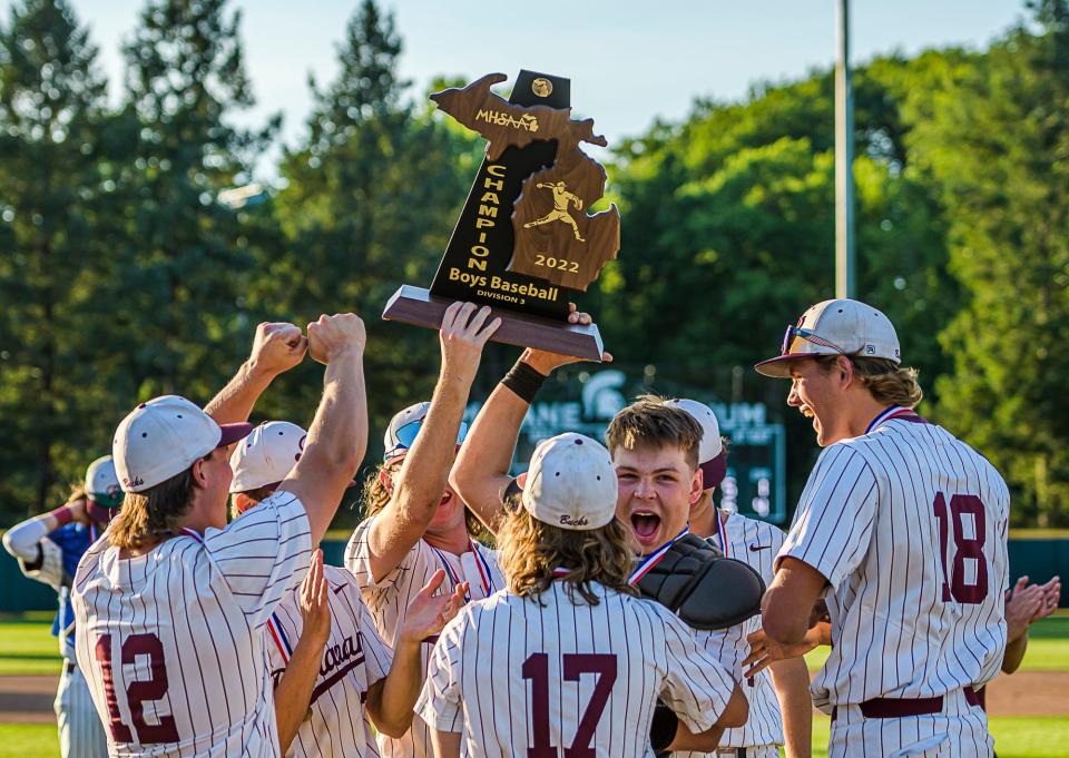 Members of the Buchanan baseball team lift the Division 3 Baseball State Championship trophy after their 3-1 win over Detroit Edison Saturday, June 18, 2022 at McClane Stadium on the Michigan State University campus in East Lansing. KEVIN W. FOWLER PHOTO