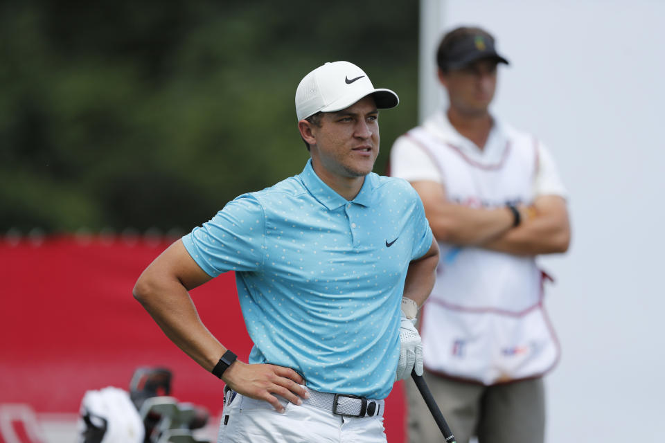 Cameron Champ waits to drive on the 10th tee during the first round of the Rocket Mortgage Classic golf tournament, Thursday, July 2, 2020, at the Detroit Golf Club in Detroit. Champ was cleared to join the field at the Rocket Mortgage Classic under a modified PGA Tour policy that allows players who test positive for the coronavirus to be eligible if they had no symptoms and get two negative test results at least 24 hours apart. (AP Photo/Carlos Osorio)