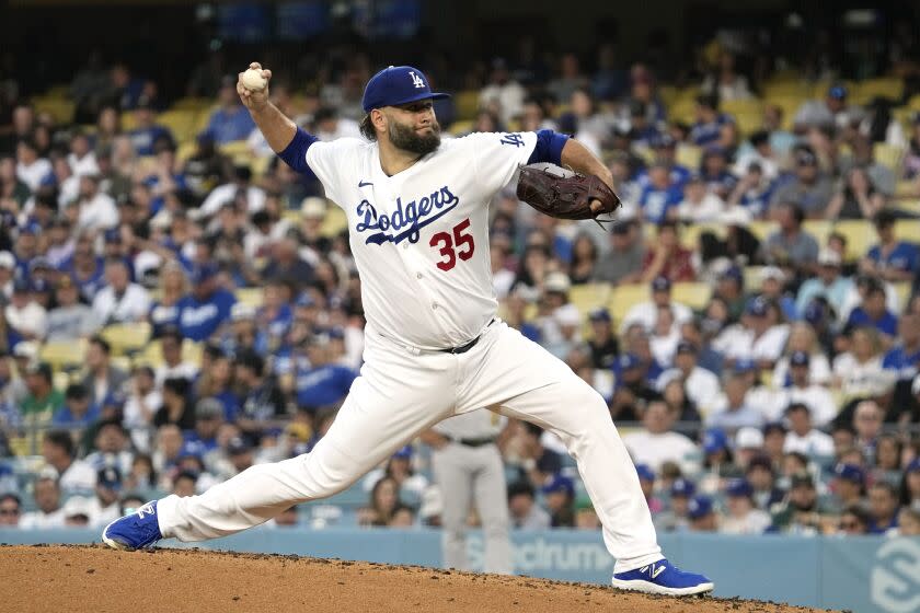 Los Angeles Dodgers freshman outfielder Lance Lane throws to the plate during the second inning of a baseball game against the Oakland Athletics Tuesday, Aug. 1, 2023, in Los Angeles.  (AP Photo/Mark J. Terrill)