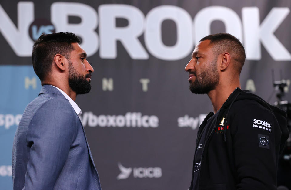 Pictured left is Amir Khan staring down British boxing rival Kell Brook.