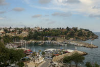 A general view of the old harbour, in Antalya, southern Turkey, Monday, June 21, 2021. Hotels in Turkey's Antalya region, a destination beloved by holidaymakers, are preparing to finally resume operations as they expect the return of international tourists after months of setbacks caused by the pandemic that halted travel. (AP Photo/Emrah Gurel)