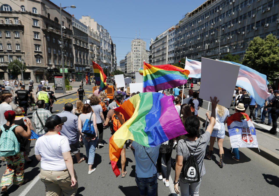 Gay rights activists walk during Serbia's gay pride march in Belgrade, Serbia, Saturday, June 29, 2019. Hundreds of gay and human rights activists at Serbia's gay pride event marched through the city center. (AP Photo/Darko Vojinovic)