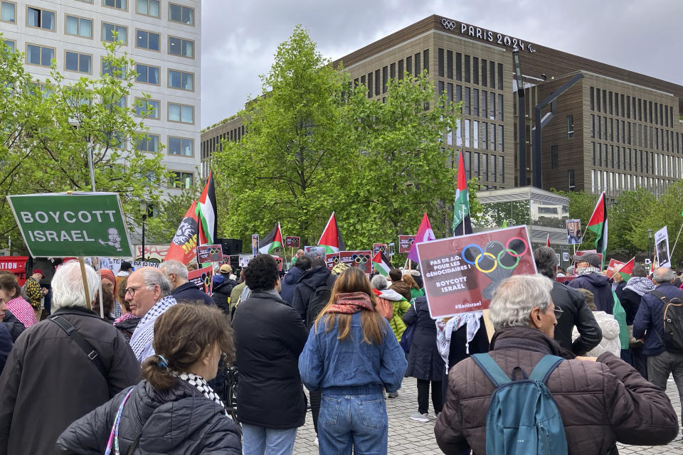 Demonstrators demanding the boycott of Israel during Olympic Games demonstrate outside the Paris Olympic organizing committee headquarters, Tuesday, April 30, 2024 in Saint-Denis, outside Paris. About 300 pro-Palestinian demonstrators took part on the protest. (AP Photo/Alexander Turnbull)