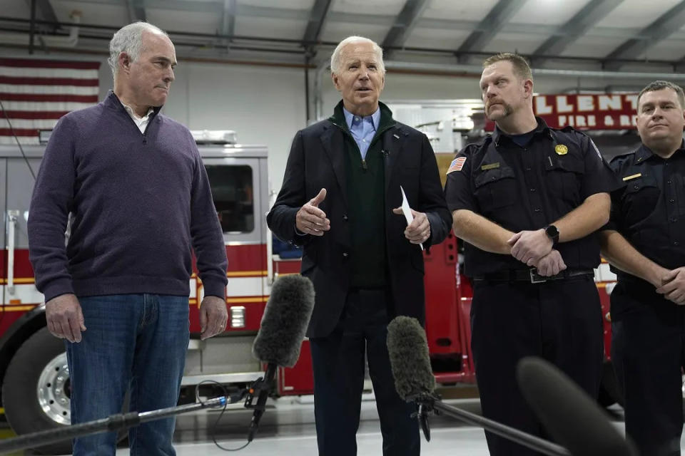 President Joe Biden at an Allentown, Pa. fire station with Sen. Casey, left