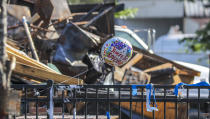 The Wendy's where Rayshard Brooks was killed by Atlanta police last month was torn down in Atlanta on Tuesday, July 14, 2020. Construction crews used an excavator to demolish the charred remains of the University Avenue restaurant. It is not clear who ordered Tuesday's demolition, which comes a little more than a week after demonstrators who had camped out at the site following Brooks' death were forced off the property. The Wendy's became ground zero for protests after Brooks was shot in the parking lot following an attempted DUI arrest in the drive-thru line June 12. The restaurant was set on fire the following day during one of those demonstrations. Garrett Rolfe, the officer who fired the deadly shots, was charged with murder and fired from the department. He is free on $500,000 bond. For weeks, protesters remained at the torched restaurant and refused to leave until demands for police reform and a memorial to Brooks' memory were met. That changed when city leaders sent officers to clear the site July 6 in response to the killing of 8-year-old Secoriea Turner, who was shot across the street from the Wendy's during a violent July 4 weekend in Atlanta. (John Spink/Atlanta Journal-Constitution via AP)