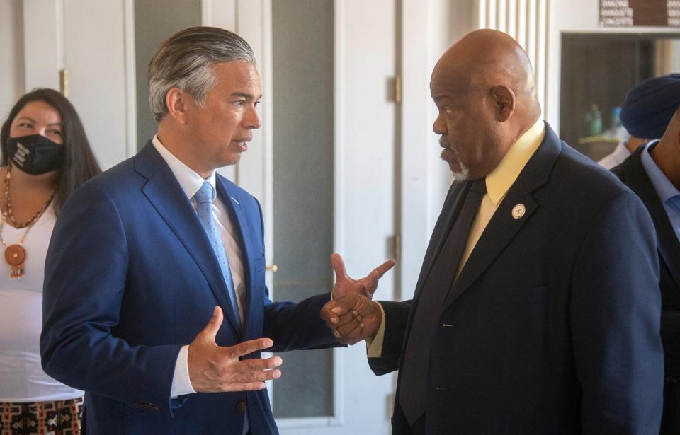 California Attorney General Rob Bonta, left, speaks to NACCP Stockton branch president Bobby Bivens after a hate crimes roundtable discussion with other community leaders at the Memorial Civic Auditorium in downtown Stockton on Tuesday.