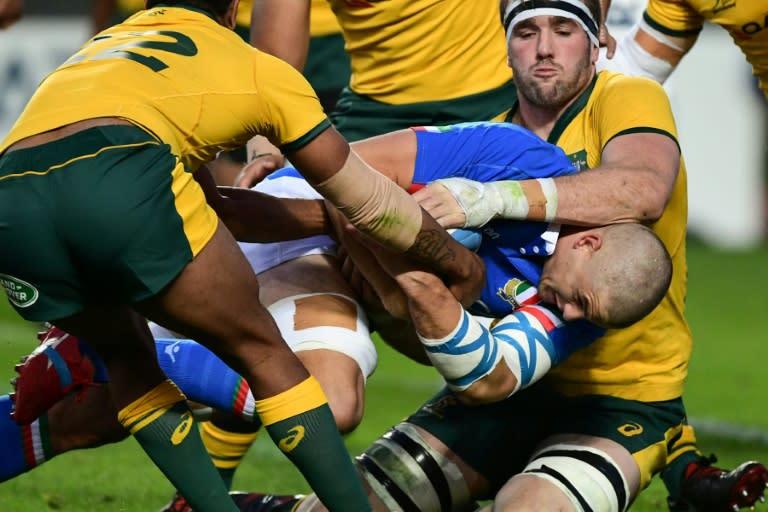 Australia's lock Izack Rodda tackles Italy's flanker Johan Meyer during the Wallabies 26-7 victory